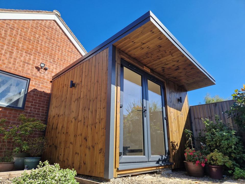 Timber-lined canopy over the French doors